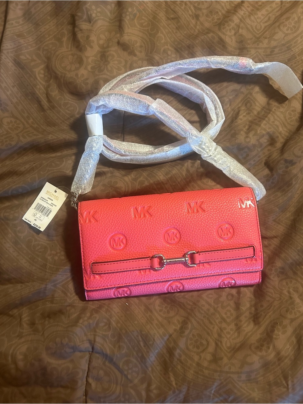 Michael Kors Embossed MK wallet on a chain